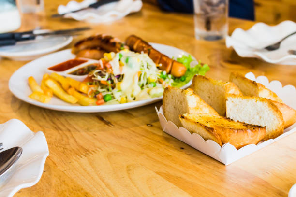 istock steak and sausage with salad 827457676