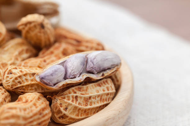 Peanuts in shell on white background