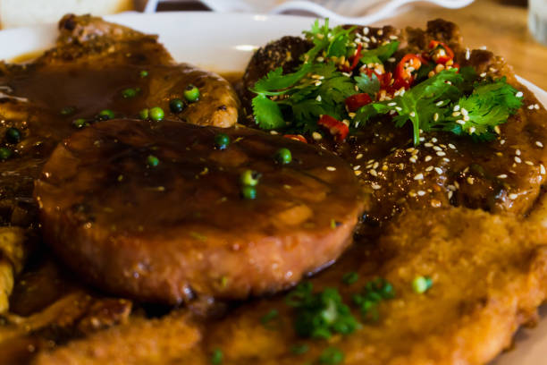istock steak and sausage with salad 827458216