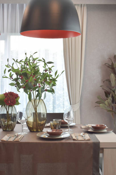 istock Modern classic dining set with hanging lamp in luxury dining room 827461946