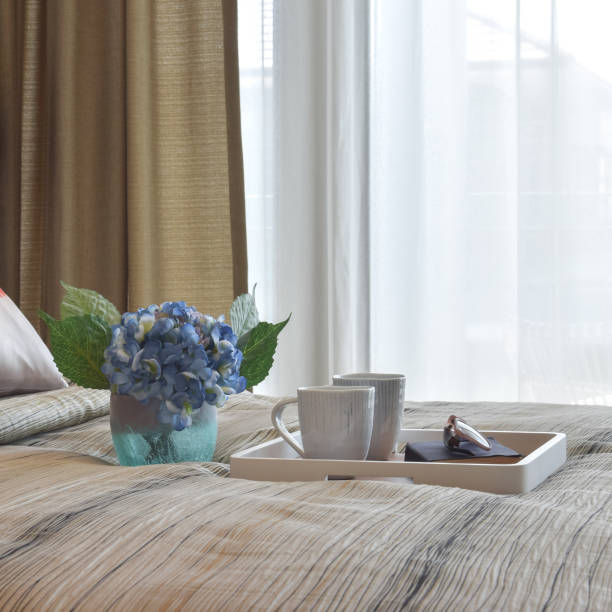 istock stylish bedroom interior design with decorative tray on bed 827464042