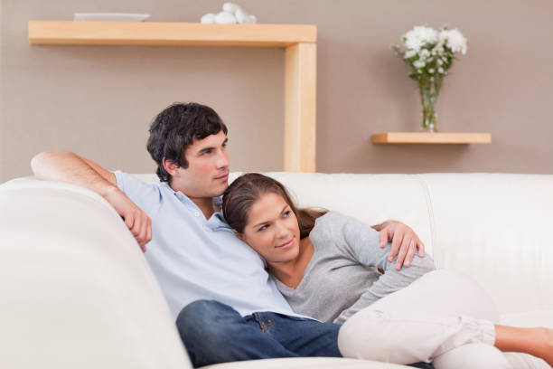 istock Couple being together on the couch 827464084
