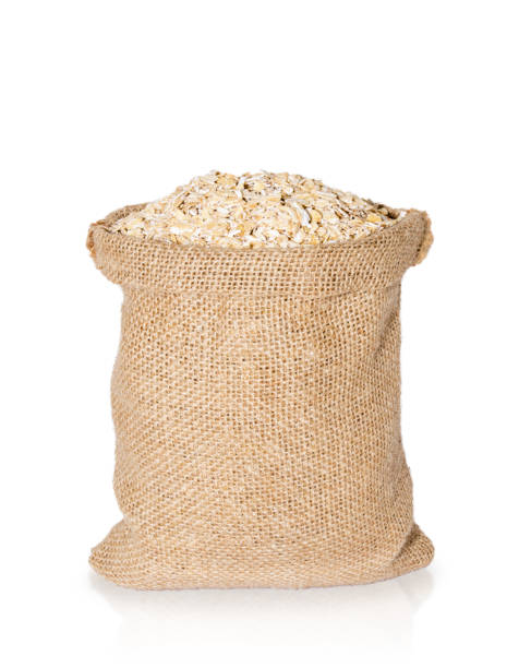 istock oat flakes in bag from sacking isolated on white background 827465238