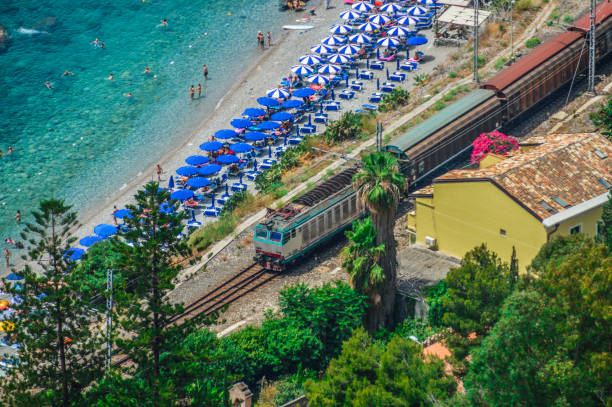 Sicilian coastline near Taormina - Giardini Naxos, Italy Sicilian coastline near Taormina - Giardini Naxos, Italy giardini naxos stock pictures, royalty-free photos & images