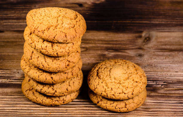 istock Stack of the oatmeal cookies on wooden table 827470652
