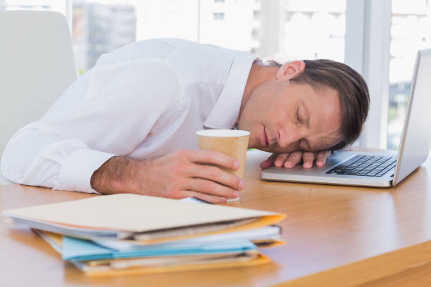 istock Businessman sleeping on a laptop 827474086