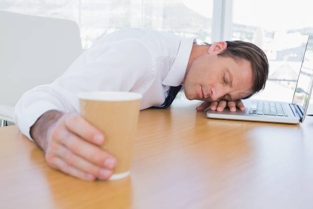 istock Asleep businessman on his laptop 827474112