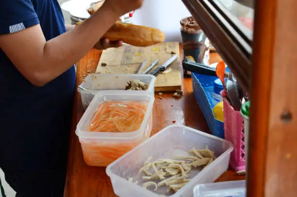 Photo of Laotian people cooking Khao Jee Sandwich or Baguette Sandwich