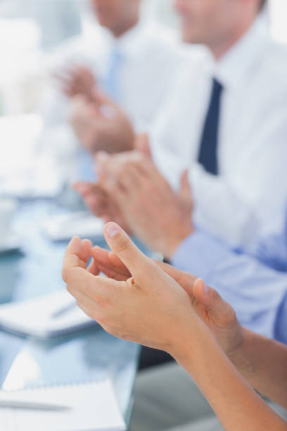 istock Business people applauding together 827474826