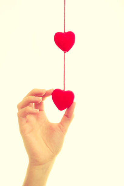 istock Female hand with little hearts. 827478736