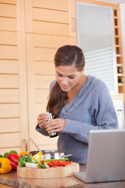 istock Woman spicing her meal 827482284