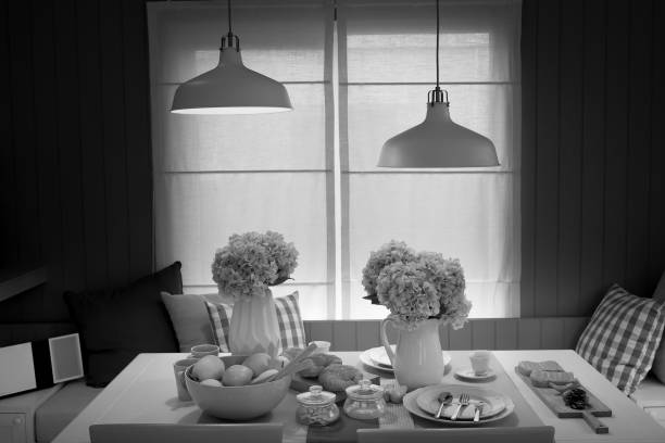 istock The white lamp hanging from the ceiling floor over dining table. 827482638