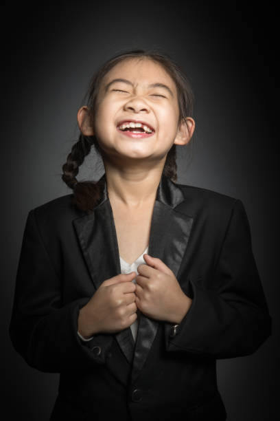 Asian girls studio portrait with smile face , on gray background
