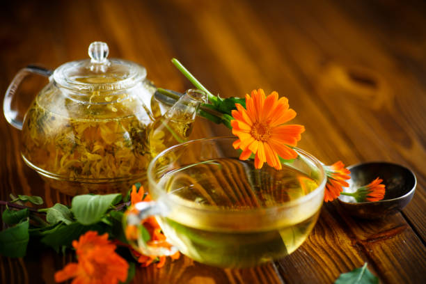 istock Therapeutic tea from flowers of calendula 827485738