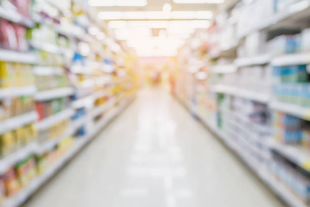 istock Empty Supermarket Aisle and Shelves in blur background 827486020