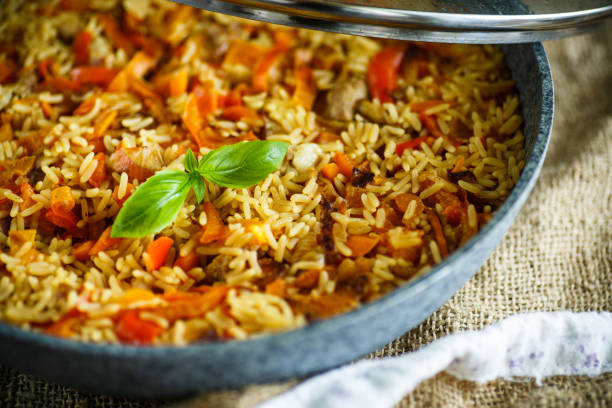 istock Pilaf with beef, carrots, onions, garlic, pepper and cumin. 827489552