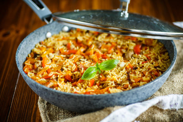 istock Pilaf with beef, carrots, onions, garlic, pepper and cumin. 827489616
