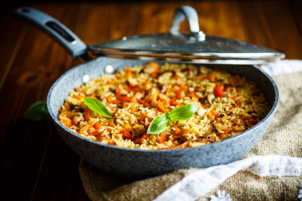 istock Pilaf with beef, carrots, onions, garlic, pepper and cumin. 827489644