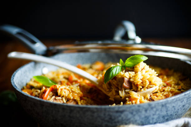 Pilaf with beef, carrots, onions, garlic, pepper and cumin. stock photo