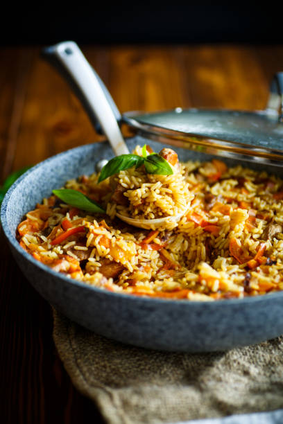 istock Pilaf with beef, carrots, onions, garlic, pepper and cumin. 827489700