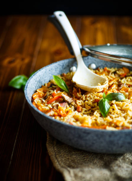 istock Pilaf with beef, carrots, onions, garlic, pepper and cumin. 827489730