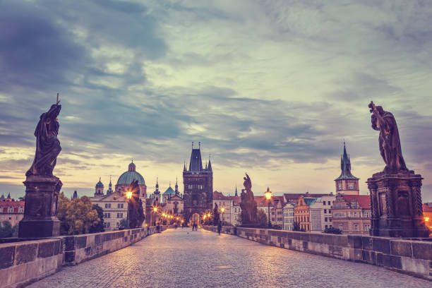 View of Charles Bridge in Prague with blue sky and clouds, Czech Republic during blue hour sunrise View of Charles Bridge in Prague with blue sky and clouds, Czech Republic during blue hour sunrise. prague skyline panoramic scenics stock pictures, royalty-free photos & images