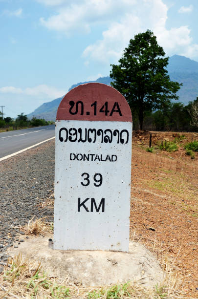 Old Milestone on the road information distance Dontalad with Pakse on May 1, 2015 in Champasak, Laos