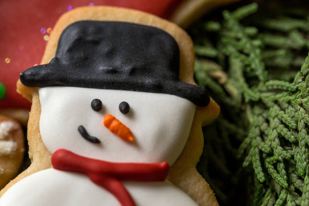 istock Christmas cookies on wooden table 827494372