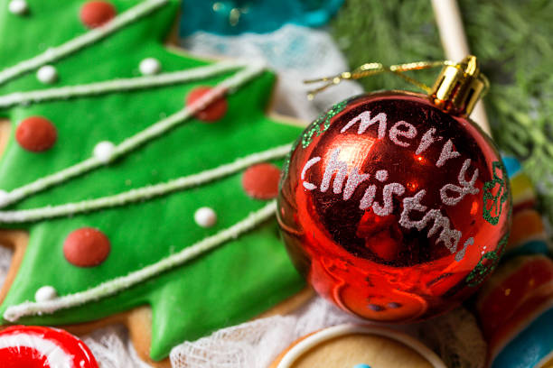 istock Christmas background with decorations and gift boxes on wooden board. 827494396
