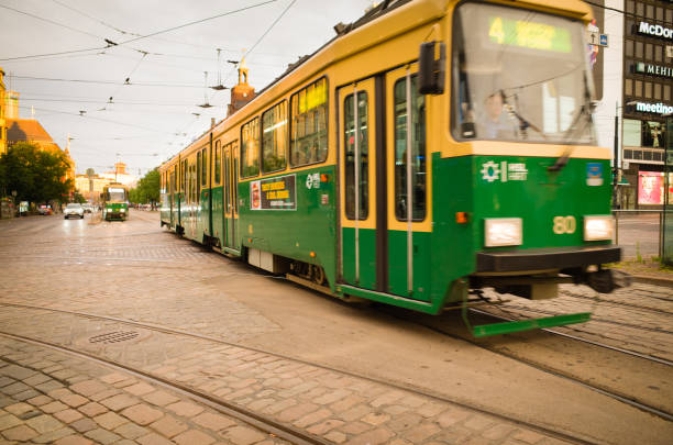 Helsinki, Finland - 30 June, 2017: HSL - HRT tram traverses road junction in central Helsinki. Helsinki Regional Transport Authority (HSL HRT) is the government authority responsible for the city's popular and widely-used public transport system.