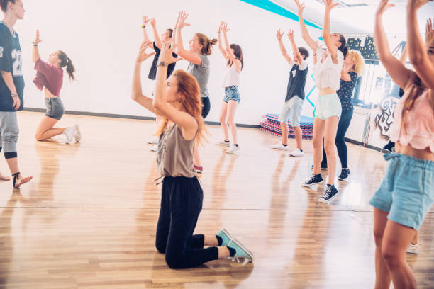 istock Active Teenage Girls Learning to Dance Choreography 827503334
