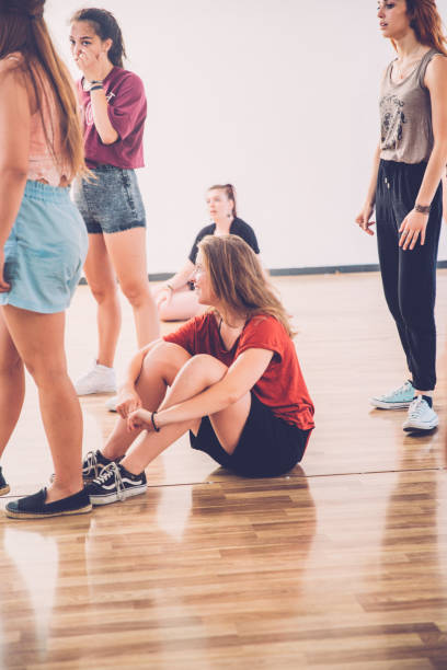 istock Teenage Girls Resting on Dance Training 827503354