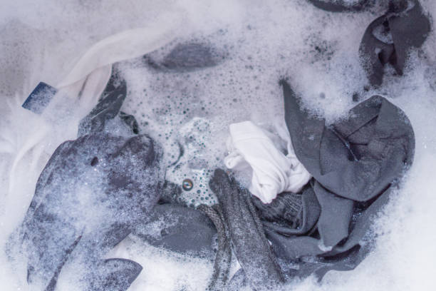 istock Washing clothes in the washing machine. 827505994