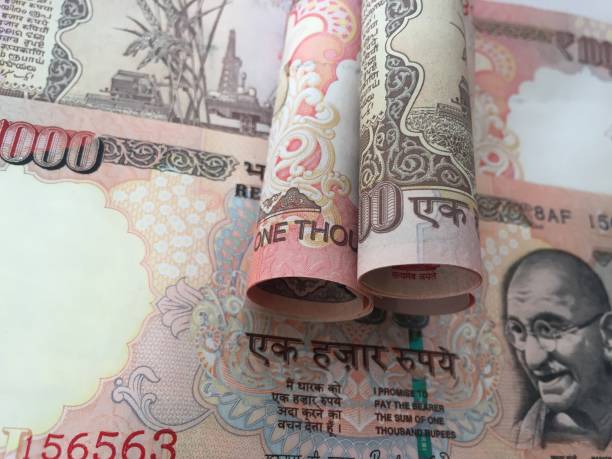 istock old rolled indian thousand(1000 )currency with 1000 background 827514886