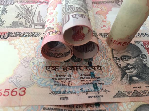 istock old rolled indian thousand(1000 )currency with 1000 background 827515038