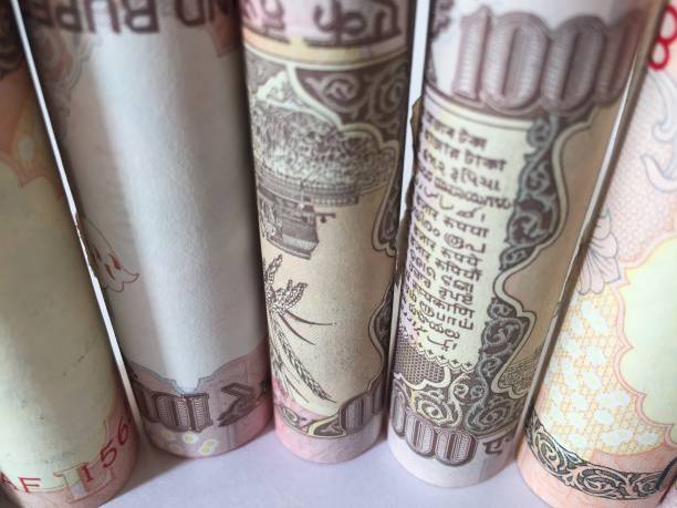 istock old rolled indian thousand(1000 )currency white background 827515658