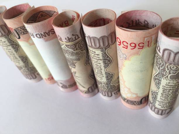 istock old rolled indian thousand(1000 )currency white background 827520550
