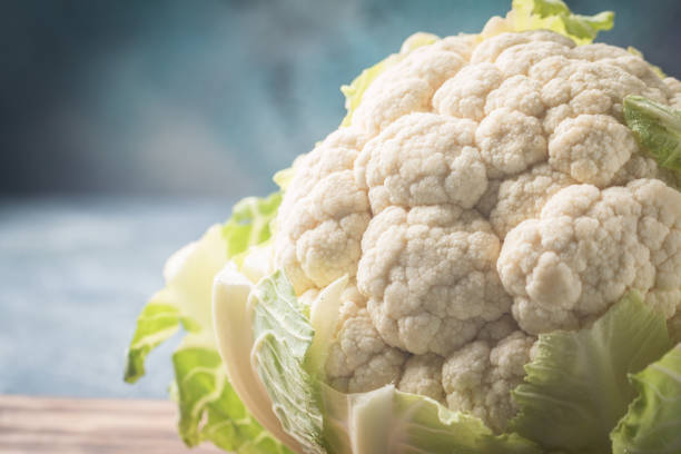 istock Organic cauliflower on gray background 827523572