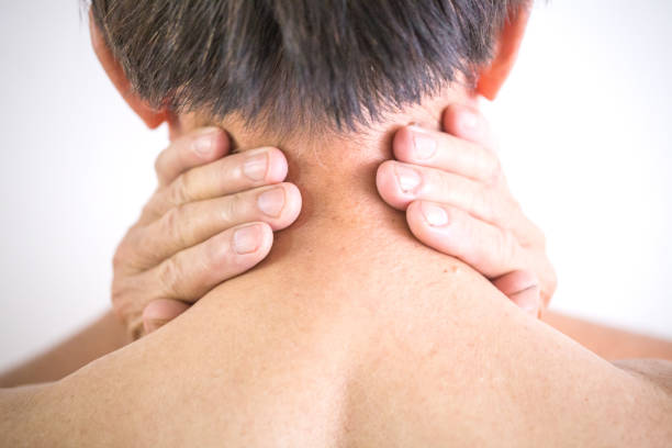 istock old man hands touch his neck rear view 827526606