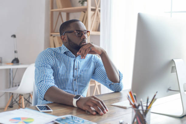 istock Young african man working in the office business 827526760