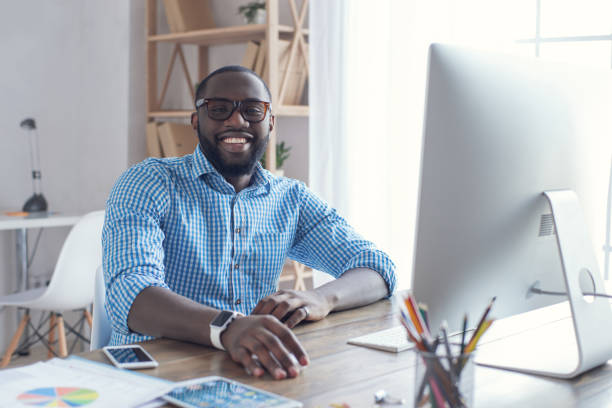 istock Young african man working in the office business 827526822