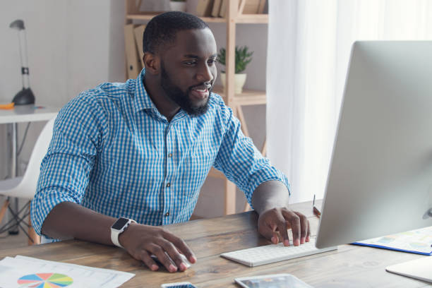 istock Young african man working in the office business 827527482