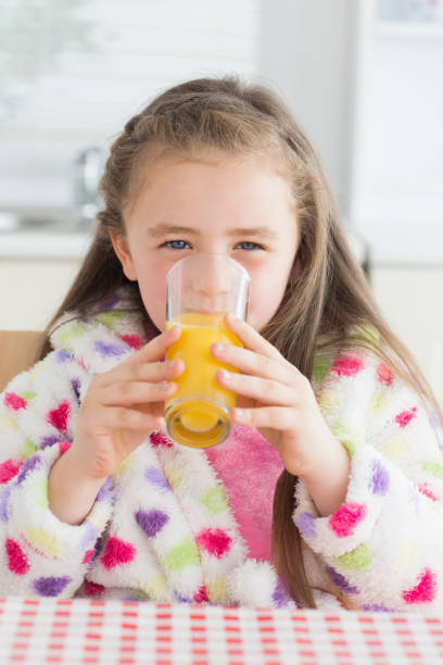 istock Girl drinking juice 827528142