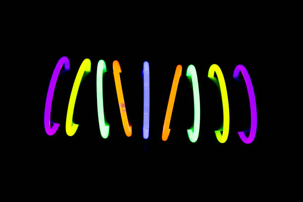 Trendy color, neon bracelets, on black background. Beauty fashion concept. Shallow depth of focus.