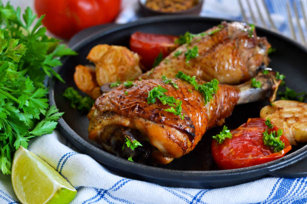 istock Grilled chicken with pesto sauce and vegetables. 827531522
