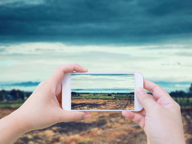 istock Taking photo of agricultural fields 827532500