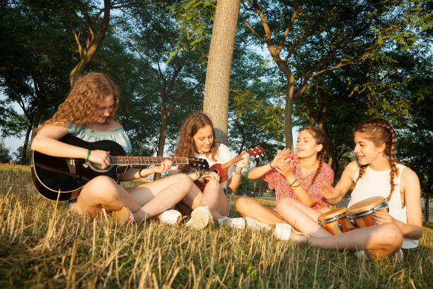 istock Young group of friends playing music 827532546