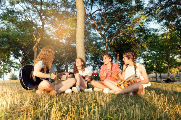 istock Young group of friends playing music 827533314