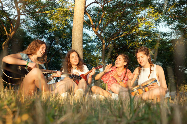 istock Young group of friends playing music 827533408
