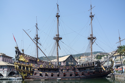 Genoa, Italy - August 1, 2017: Neptune (galleon) ship replica of a 17th-century Spanish galleon outside the Aquarium of Genoa. It is located in the old harbour area of Genoa. The ship was built in 1985 for Roman Polanski's film Pirates.